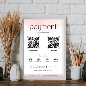 May include: A framed sign with the word "payment" in elegant script, with "accepted here" below. It displays QR codes for Cash App and Venmo, along with icons for cash, credit card, PayPal, and Apple Pay. The sign includes social media handles and a website address.