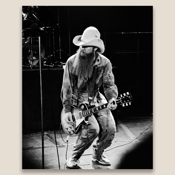 Billy Gibbons, ZZ Top performing on stage at a concert in 1981. Restored vintage black and white photo printed at museum quality.