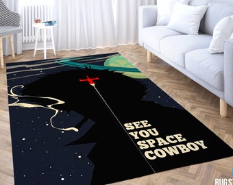 May include: A black and blue rug with a silhouette of a character from the anime series Cowboy Bebop. The character is holding a gun and a spaceship is flying in the background. The text "See You Space Cowboy" is printed on the rug.