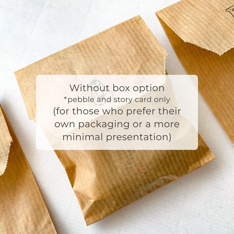 May include: Three brown paper packages, with a white rectangle overlay containing text. The text reads: "Without box option *pebble and story card only (for those who prefer their own packaging or a more minimal presentation)".