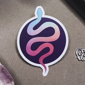 May include: A sticker featuring a colorful gradient snake design on a dark purple background. The snake is curled in a circle and has a light blue head.