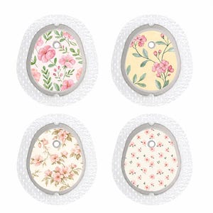 May include: Four medical device patches with floral designs. Each patch has a different pattern of pink flowers and green leaves on a cream or yellow background, surrounded by a white, textured border.