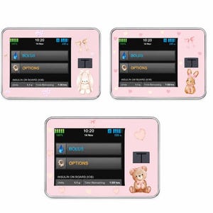 May include: Three pink insulin pump covers with decorative elements. Each cover displays a screen with the time, date, and insulin information. One cover features a bow and a bunny, another a bow and a rabbit, and the last a teddy bear.