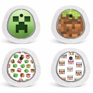 May include: Four medical device covers featuring Minecraft designs. The designs include a green Creeper face, a pixelated dirt and grass block, a pattern of TNT blocks and Creepers, and a pattern of sheep faces.
