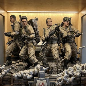 May include: A detailed figurine of the Ghostbusters team in their iconic uniforms, posed in action. The figures are set on a detailed base with a Ghostbusters logo, and a smoky effect. The display is enclosed in a wooden cabinet.
