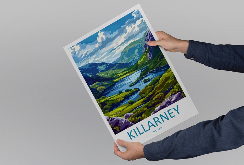 May include: A colorful poster with a scenic view of Killarney, Ireland. The poster features a lake surrounded by lush green hills and a blue sky with white clouds. The text "KILLARNEY, IRELAND" is printed in blue at the bottom of the poster.