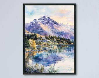May include: Watercolor painting of a mountain landscape with a lake. The artwork features a snow-capped mountain range, a serene lake reflecting the sky, and a village nestled at the base of the mountains. The painting is framed in a black frame.