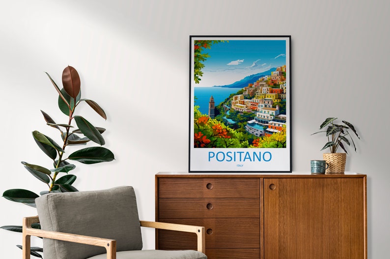 Puede incluir: Un p&oacute;ster colorido con marco negro que representa una ciudad costera con edificios coloridos en una ladera. El texto "POSITANO ITALIA" est&aacute; en la parte inferior del p&oacute;ster.