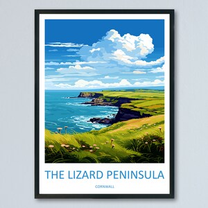 May include: A framed poster with a colourful illustration of a coastal landscape. The poster features a view of a green grassy cliff overlooking a blue ocean with a large white cloud in the sky. The text "THE LIZARD PENINSULA CORNWALL" is printed at the bottom of the poster.