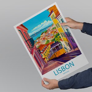 May include: A colorful illustration of a street scene in Lisbon, Portugal. The image features a yellow tram traveling uphill, with colorful buildings and a bridge in the background. The text "LISBON PORTUGAL" is printed at the bottom of the image.