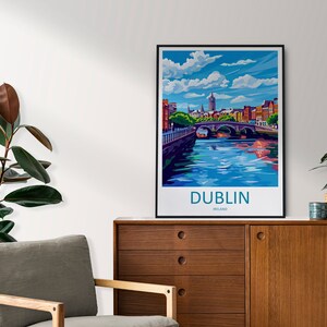 May include: A colorful illustration of the city of Dublin, Ireland. The image features a bridge over a river with buildings and a tall spire in the background. The text "DUBLIN, IRELAND" is printed below the image.