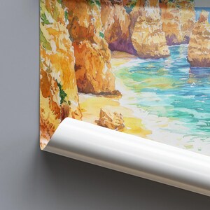 May include: Watercolor painting of a coastal landscape featuring golden cliffs, a sandy beach, and turquoise water. The artwork captures the natural beauty of the coastline with soft brushstrokes and vibrant colors. The image is partially rolled.