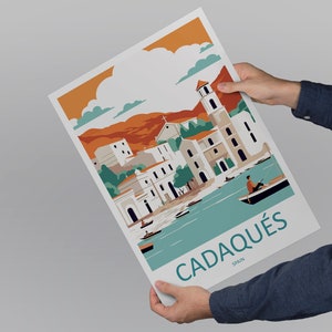 May include: A colorful illustration of the town of Cadaqu&eacute;s, Spain. The illustration features a white church with a bell tower, white buildings with orange roofs, and a blue bay with boats. The text "Cadaqu&eacute;s, Spain" is printed in blue at the bottom of the illustration.