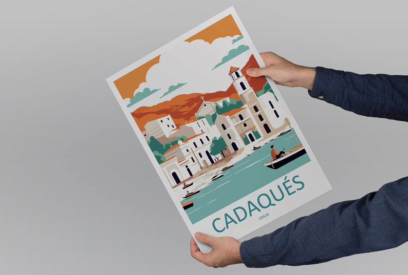 May include: A colorful illustration of the town of Cadaqu&eacute;s, Spain. The illustration features a white church with a bell tower, white buildings with orange roofs, and a blue bay with boats. The text "Cadaqu&eacute;s, Spain" is printed in blue at the bottom of the illustration.