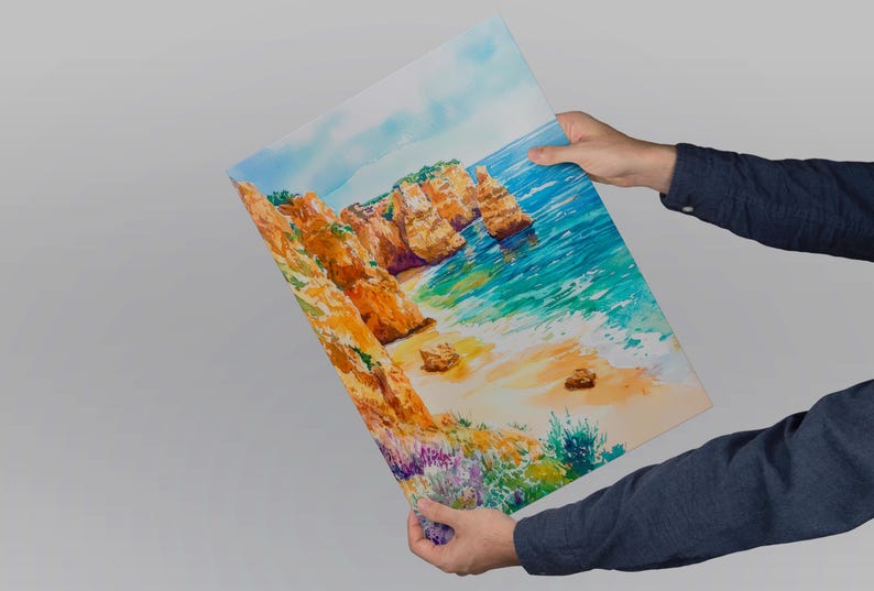 May include: A vibrant watercolor painting of a coastal landscape featuring golden cliffs, turquoise water, and a sandy beach. The artwork depicts a sunny day with a clear sky and colorful vegetation.