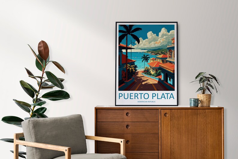 May include: A vintage travel poster featuring a colourful illustration of a street in Puerto Plata, Dominican Republic. The poster has a blue sky with white clouds, palm trees, and a view of the ocean.