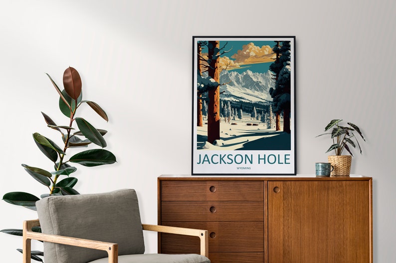 May include: A vintage-style poster featuring a snowy mountain scene with the text "JACKSON HOLE WYOMING". The poster is framed in black and uses a blue, green, and brown colour scheme.