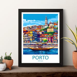 May include: Framed art print of Porto, Portugal, featuring colorful buildings, a river, and a boat. The artwork has a vibrant, stylized design with a blue sky and the word "PORTO" at the bottom.