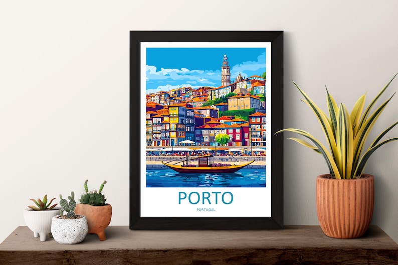 May include: Framed art print of Porto, Portugal, featuring colorful buildings, a river, and a boat. The artwork has a vibrant, stylized design with a blue sky and the word "PORTO" at the bottom.