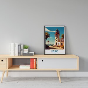 May include: A framed illustration of a lighthouse in Faro, Portugal. The illustration is in a retro style with a blue sky, palm trees, and a white lighthouse with a red roof. The text "FARO, PORTUGAL" is printed below the illustration.
