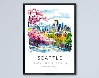 May include: A framed watercolour print of Seattle, Washington, showing the Space Needle, cityscape, and cherry blossoms. The print includes the city's name, coordinates, and state. The artwork is in a black frame.