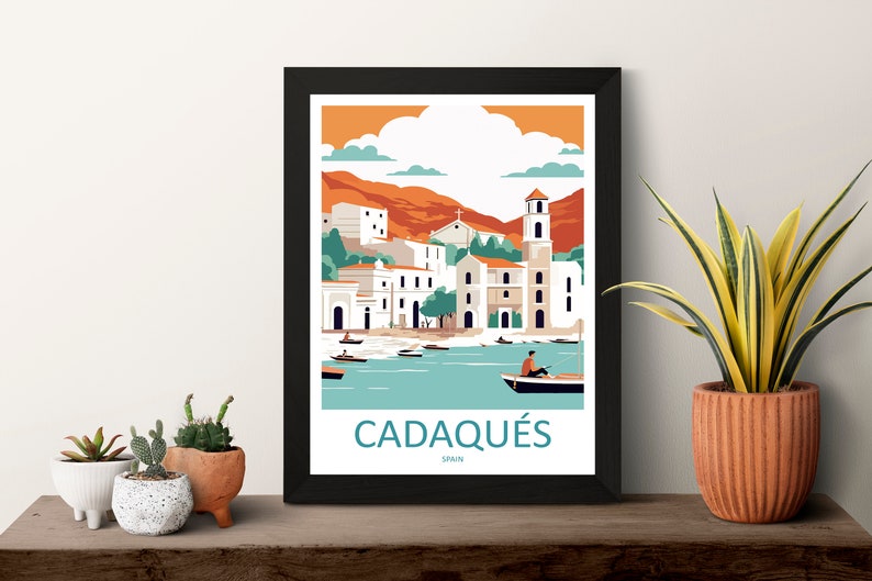 May include: A colorful illustration of the town of Cadaqu&eacute;s, Spain. The image features a white church with a tall bell tower, a mountain range in the background, and a blue body of water with boats. The text "Cadaqu&eacute;s, Spain" is printed below the image.