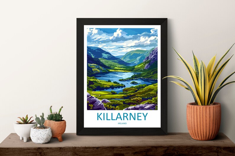May include: A framed poster with a colorful illustration of a lake and mountains. The text "KILLARNEY, IRELAND" is at the bottom of the poster.