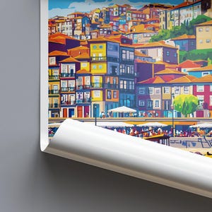 May include: A colorful art print depicting a European cityscape with buildings of various colors, including yellow, red, and blue. The print shows a waterfront scene with boats and people, and a partially unrolled edge.