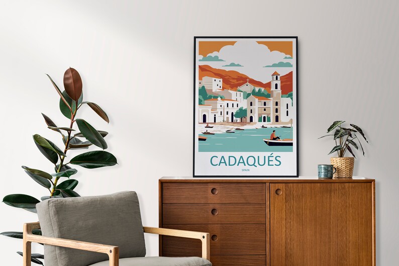 May include: A colorful illustration of the town of Cadaqu&eacute;s, Spain, with a view of the harbor and boats. The illustration is in a minimalist style with a flat design and bold colors. The text "Cadaqu&eacute;s, Spain" is printed below the illustration.