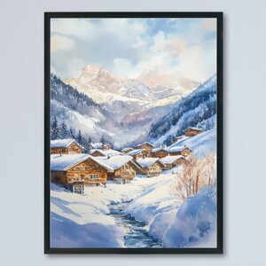 May include: A watercolour painting depicting a snow-covered village in a mountain valley. The artwork shows wooden houses with snow-covered roofs, a stream, and snow-covered mountains under a cloudy sky. The painting is framed in a black frame.