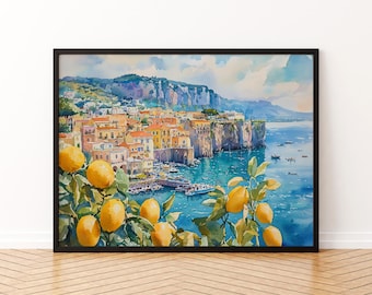 May include: Watercolor painting of a coastal Italian town with colorful buildings and a harbor. Lemon branches with ripe yellow fruit are in the foreground. The artwork is framed in a black frame and set against a white wall.