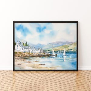 May include: Watercolor painting of a coastal village with white buildings, a pier, and sailboats on the water. The artwork features a blue sky with clouds and green hills in the background. The painting is framed in a black frame.