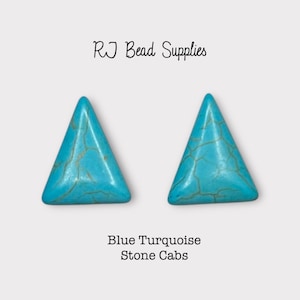 May include: Two triangular blue turquoise stone cabs with gold veining. The image includes the text "RJ Bead Supplies" and "Blue Turquoise Stone Cabs". These cabochons are ideal for jewelry making.