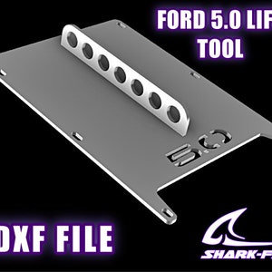 May include: A metal plate with cutouts for a Ford 5.0 lift tool. The plate is labeled "FORD 5.0 LIFT TOOL" and "DXF FILE". The Shark-Fab logo is in the lower right corner.