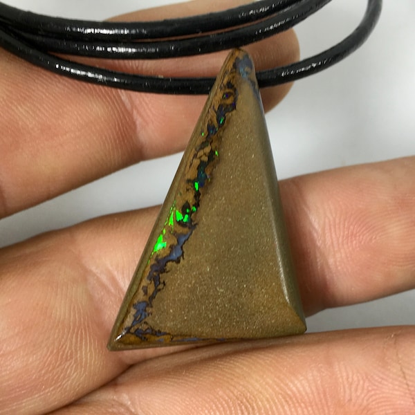 Boulder Opal pendant mounted on a black leather cord with silver tips and clasp