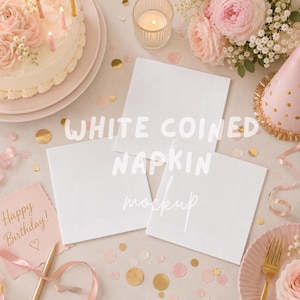 May include: Three square white paper napkins with a textured border, arranged in a cluster. The napkins feature a subtle embossed edge detail and are displayed alongside a birthday cake, a pink party hat, and gold confetti on a light surface.