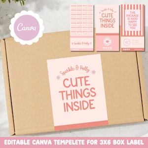 May include: A brown cardboard box with various pink and white labels. One label says "Cute Things Inside" in a playful font. Other labels read "Hand Made With Love" and "This Package is Sooo Happy to See You."