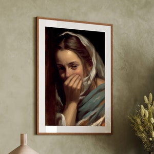 May include: A framed painting of a woman with a white headscarf, looking down and covering her mouth with her hand. The painting is set against a brown background.