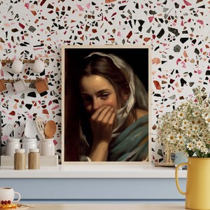 May include: A painting of a woman with long brown hair wearing a white scarf covering her mouth and nose. She is wearing a blue and white dress and has a sad expression on her face.