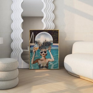 May include: A woman in a pool with a disco ball on her head and a glass of champagne in her hand. The pool is surrounded by greenery and the woman is wearing sunglasses.