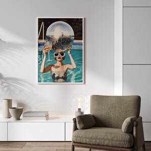 May include: A woman in a swimming pool holding a disco ball over her head and a glass of champagne in her other hand.