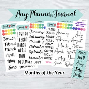 May include: A collection of sticker sheets featuring the months of the year in various black fonts, including script and block styles. The sheets include colourful circular dot stickers and text that reads Any Planner/Journal and Months of the Year.