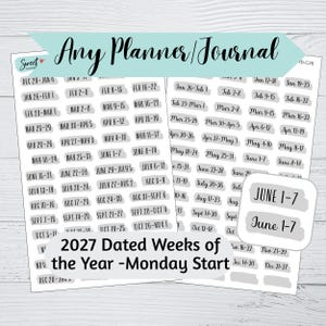 May include: A sheet of adhesive planner stickers featuring 2027 dated weeks of the year with a Monday start. Each sticker has a gray brushstroke background with black text indicating specific date ranges from December 29 to December 31.