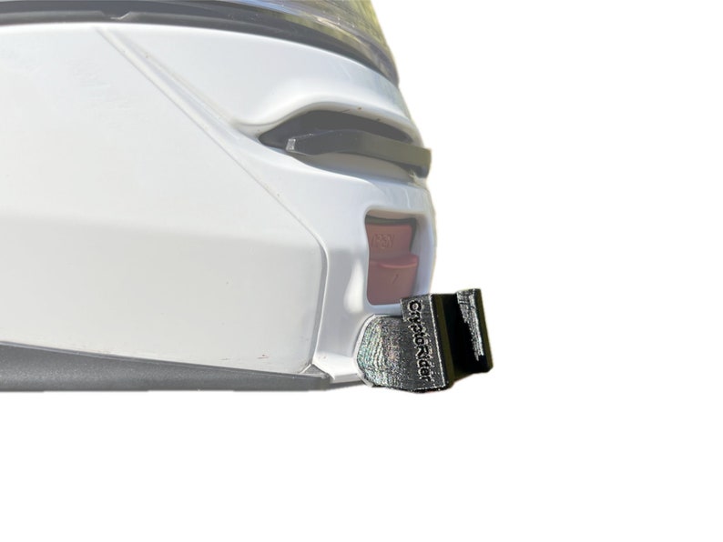 May include: A black motorcycle helmet accessory with the text "CryptoRider" printed on it.
