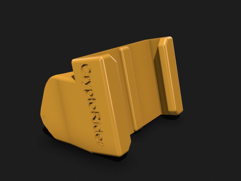 May include: A yellow plastic phone stand with the text "CryptoRider" printed on the side. The stand has two slots for holding a phone.