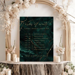 May include: A dark green wedding event schedule with gold detailing. The schedule features the names Clarissa and Nicholas, and the date June 21, 2028. The schedule lists the wedding ceremony, photographs, cocktails, speeches, dinner, toasts, reception, wedding dance, bubble send off, and after-party.