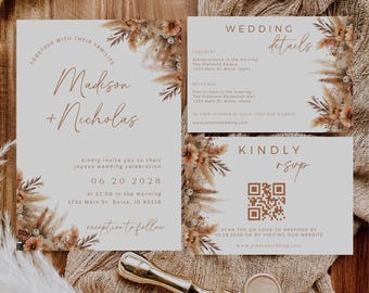 Puede incluir: Conjunto de invitaciones de boda con un tema boho. La invitación presenta un diseño floral con flores secas y hierba de la pampa. La tarjeta RSVP tiene un código QR para que los invitados respondan.