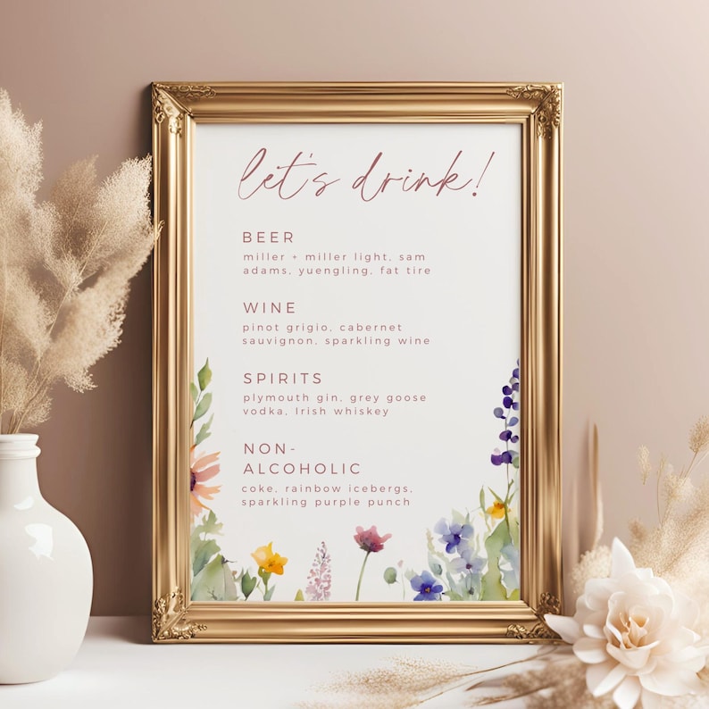 May include: A printable wedding sign with a floral design and the text "let's drink!"  The sign lists different types of alcoholic and non-alcoholic beverages, including beer, wine, spirits, and non-alcoholic options.
