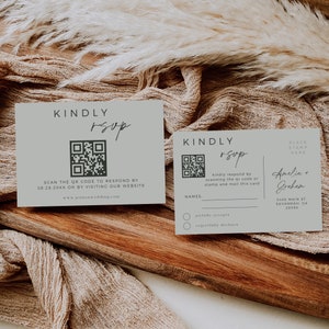 May include: Two light green RSVP cards with a QR code and the text "KINDLY RSVP". The card on the left has instructions to scan the QR code or visit the website. The card on the right has a place to write names and a section for guests to indicate if they will joyfully accept or regretfully decline the invitation. The card on the right also has the names Amelia and Grehem, an address, and a place to put a stamp.