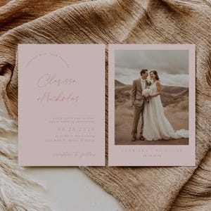 May include: A pink wedding invitation with a photo of the couple in a desert landscape. The invitation includes the couple's names, wedding date, time, and location. The text "reception to follow" is also included.